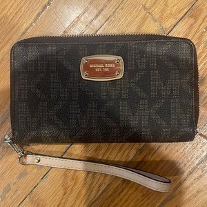 Never used Michael Kors wristlet wallet. Bought around 2015.
